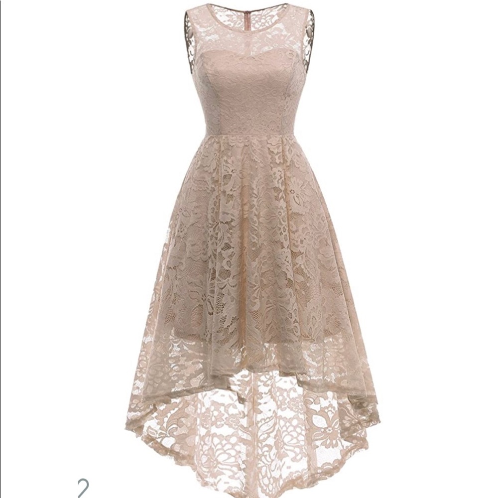 A lacey, a-symmetrical, beige dress.